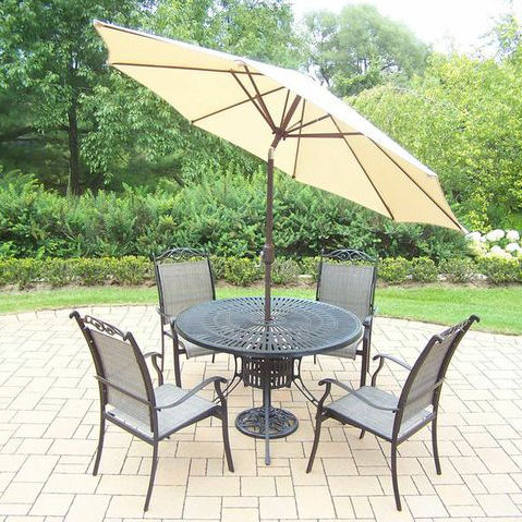 Patio Dining Sets Basile 5 Piece Dining Set This dining set is the perfect piece for any outdoor dinner setting. It's just the right size for any backyard or patio. It's constructed of rust-free cast aluminum. This dining set features a hardened powder coated finish for years of beauty. Feature...
